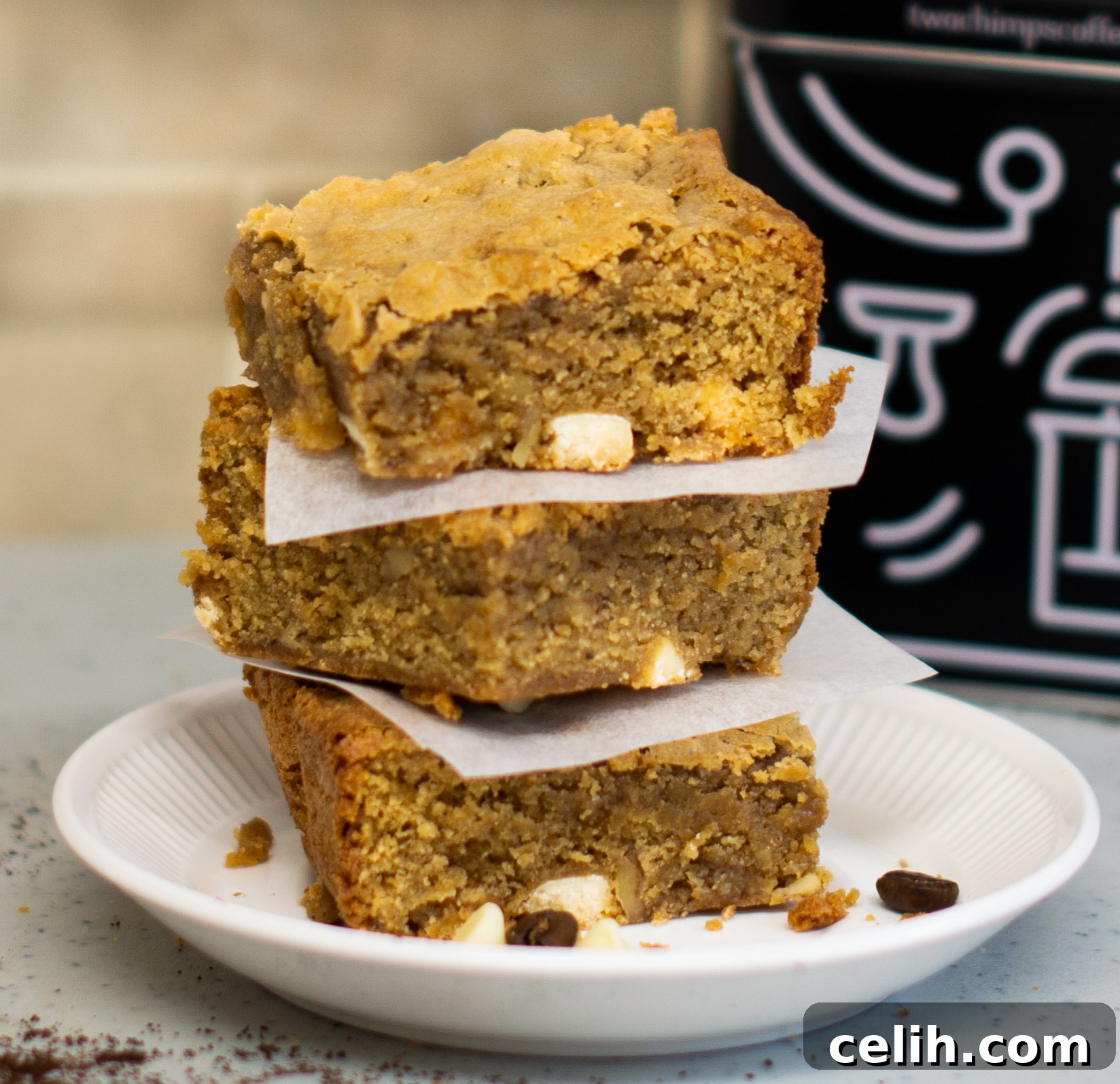 Rich and Perfectly Squidgy Mocha Blondies 2 Irresistible Mocha Blondies fresh from the oven, showcasing their perfectly baked tops and rich, coffee-infused white chocolate goodness.