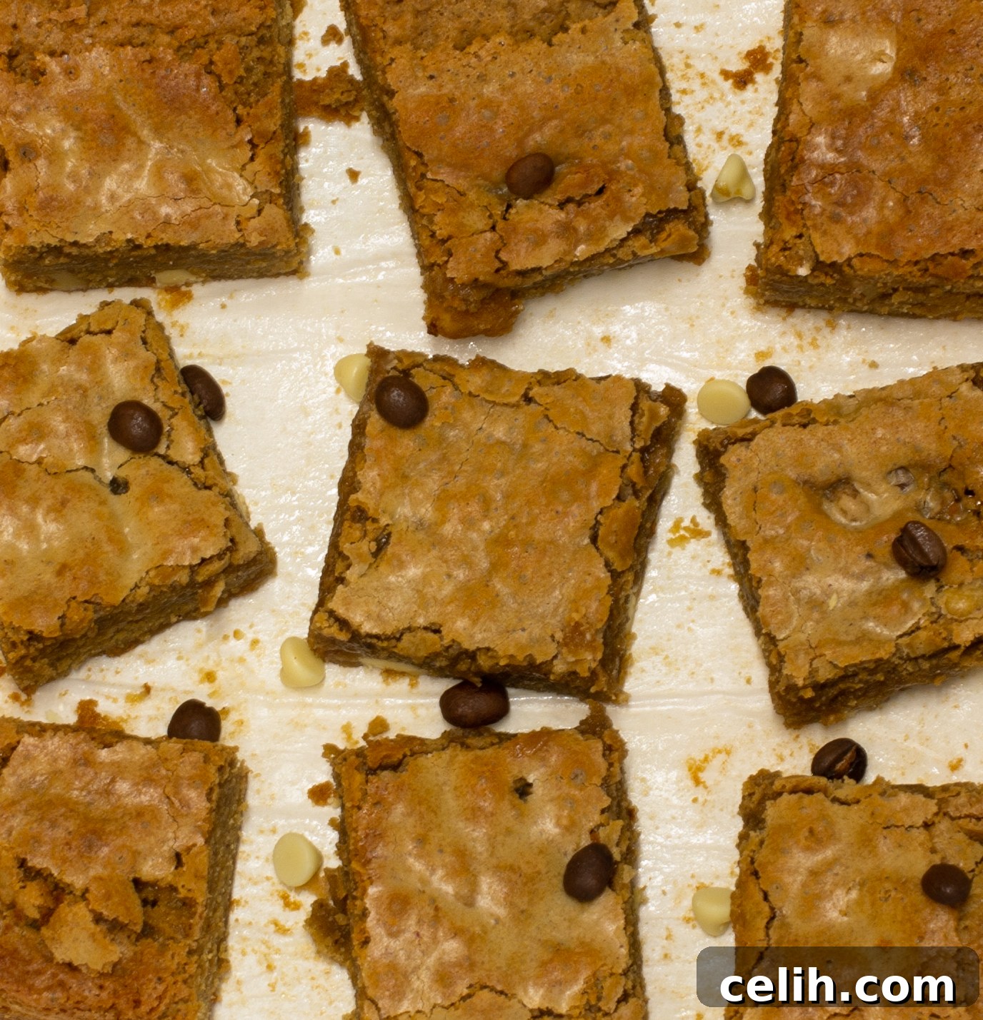 Rich and Perfectly Squidgy Mocha Blondies 5 Platter of perfectly cut, moist mocha blondies with creamy chocolate chunks, ready for serving.
