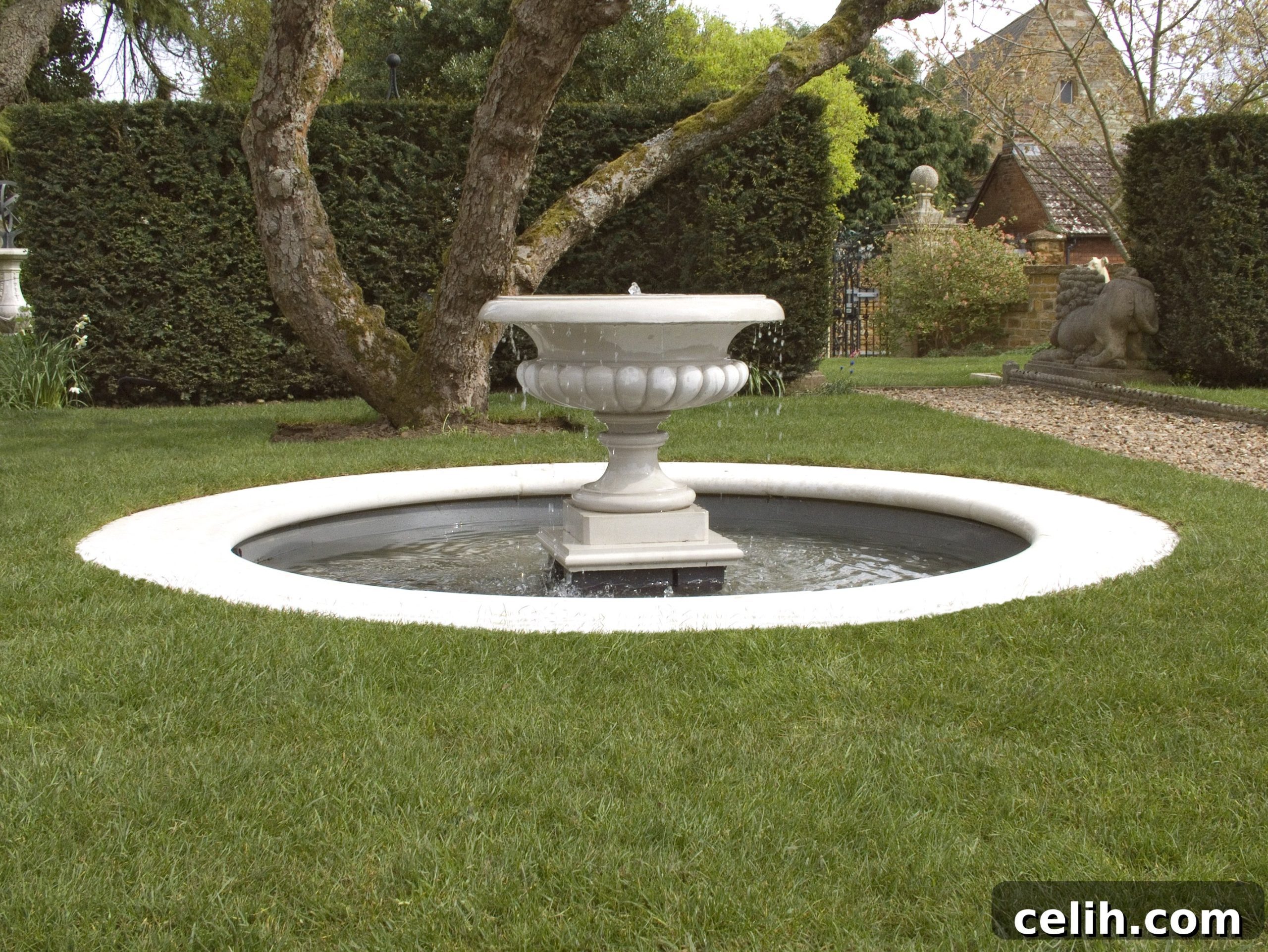 Pond Edging Ideas: Rustic Charm to Polished Perfection 8 Cast stone fountain in the middle of a garden pond edged in white concrete