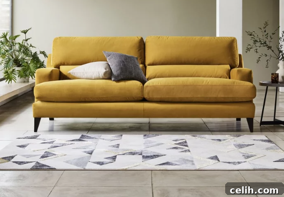 Lovely mustard yellow mid-century modern sofa - one of the top sofa style trends of 2022