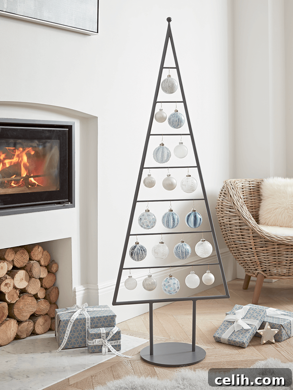Deck the Halls for Less: Friday Christmas Decor Sale at Cox and Cox 2 Scandi metal silhouette Christmas tree from Cox & Cox - modern and space-saving alternative