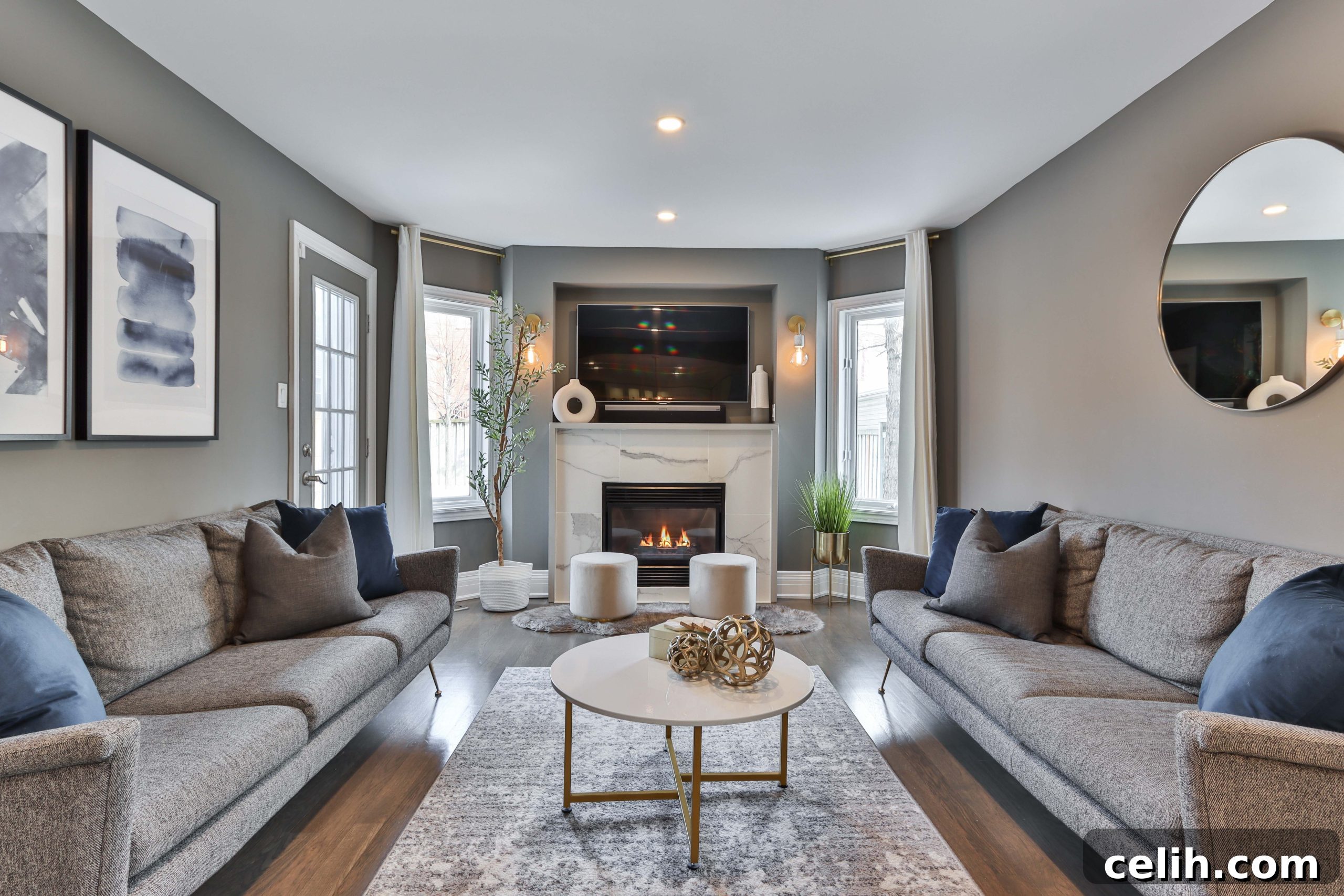 Modern white living room with integrated audio visual system and smart home controls
