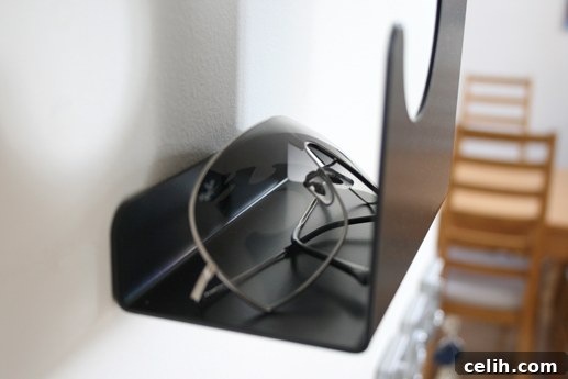 Rear view of J-me Wave Coat Rack, highlighting the convenient top shelf for small items