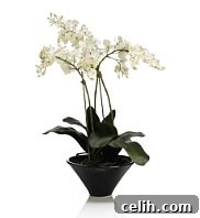 artificial-orchid-spray Realistic artificial orchids offering everlasting beauty and zero maintenance for modern home decor.