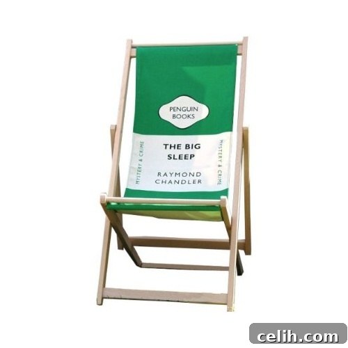 Iconic Penguin The Big Sleep Deck Chair in serene green, ideal for a relaxed afternoon