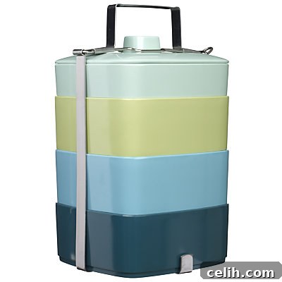 John Lewis Woodland Tiffin Box with multi-compartment design, featuring subtle shades of blue and green