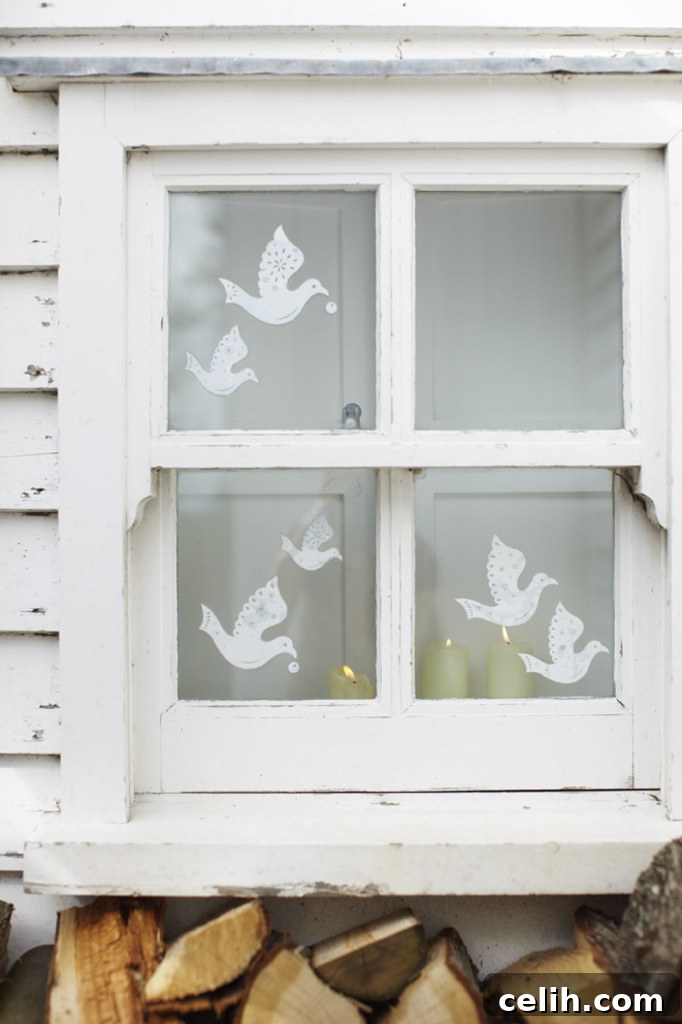 Delicate white dove window stickers with intricate cutwork detail