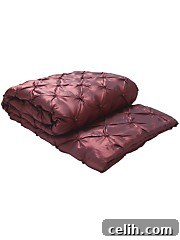 Rich wine luxurious bedding throw from Very