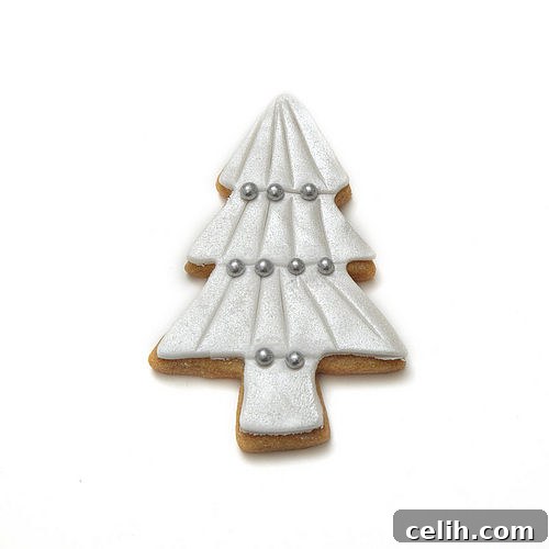 Christmas tree shaped biscuits beautifully decorated