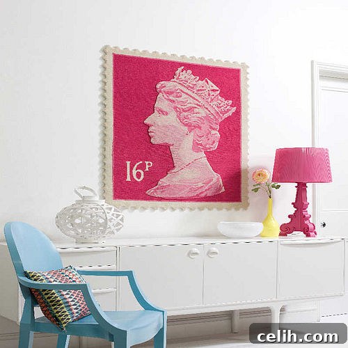 Elegant pink stamp rug presented as a piece of wall art, featuring the Queen's profile and classic scalloped edges.