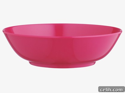 The cerise pink Indiantale bowl from Ella Doran's homeware collection for Habitat, ideal for salads or snacks.