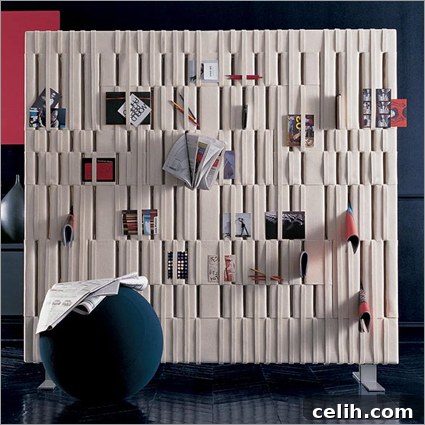 bb_italia_softwall_room-divider B&B Italia Soft Wall room divider made of felt, featuring integrated storage pockets for displaying photos, magazines, and small decorative items, designed for modern and functional interior spaces.