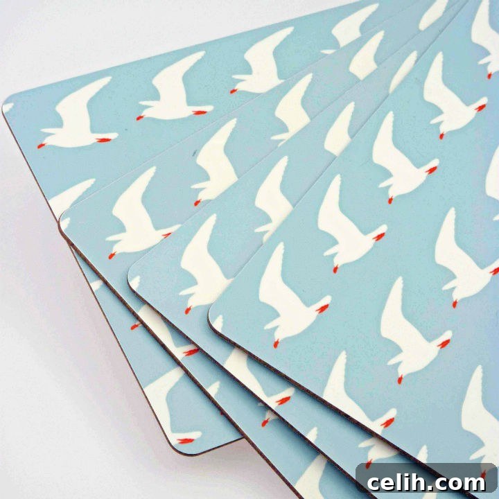 Set of four blue and white Anorak seagull print table mats for modern dining decor