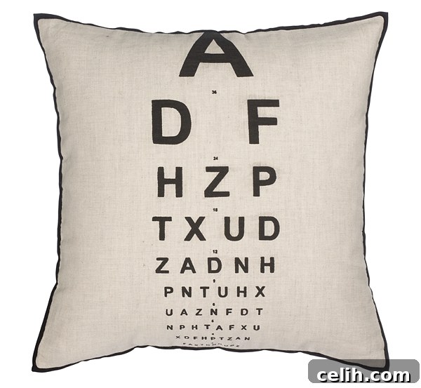Stylish eye test eye chart print cushion from John Lewis, perfect for adding a quirky touch to sofas