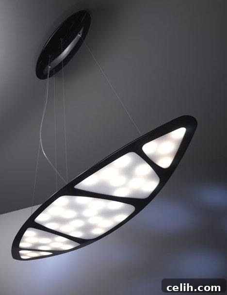 Gumdesign's Revolutionary Light Concept for Modern Interiors Gumdesign's futuristic LED lamp with a translucent panel, creating a dynamic light effect, as showcased at the Milan Design Festival.