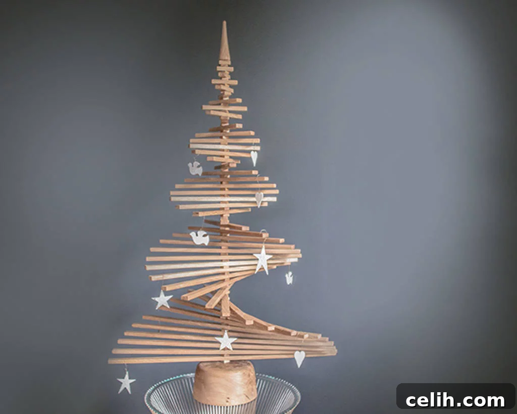 Beyond Traditional: 10 Stunning Modern Christmas Tree Designs 2 Stunning wooden Christmas tree made from English oak. It can be displayed flat or in a spiral and is very effective.