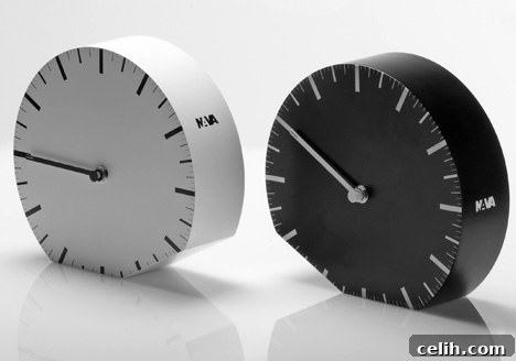 Denis Guidone's Ora ilLegale Clock A unique, minimalist black clock designed by Denis Guidone, showing no numbers and a shifting face, symbolizing time's elusive nature.
