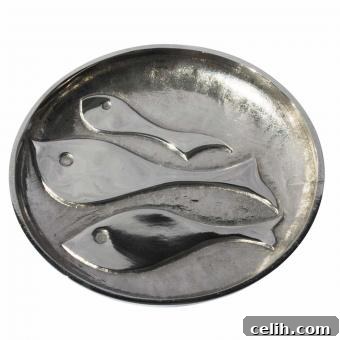 Small silver metal platter with shoaling fish design