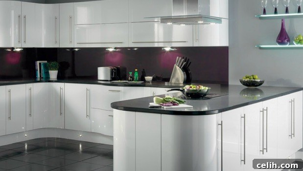 Contemporary kitchen design with beautifully curved white cupboards