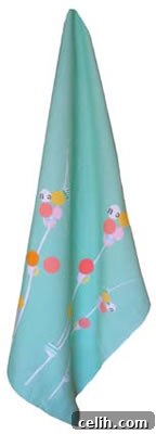 Bright turquoise tea towel with a modern sprig design and hanging tab