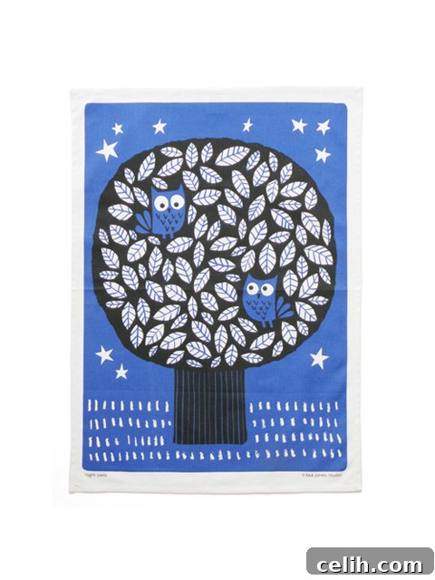 Organic fairtrade cotton tea towel with two owls perched on a tree under a starry night