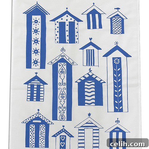 Blue and white tea towel featuring a delightful array of beach huts