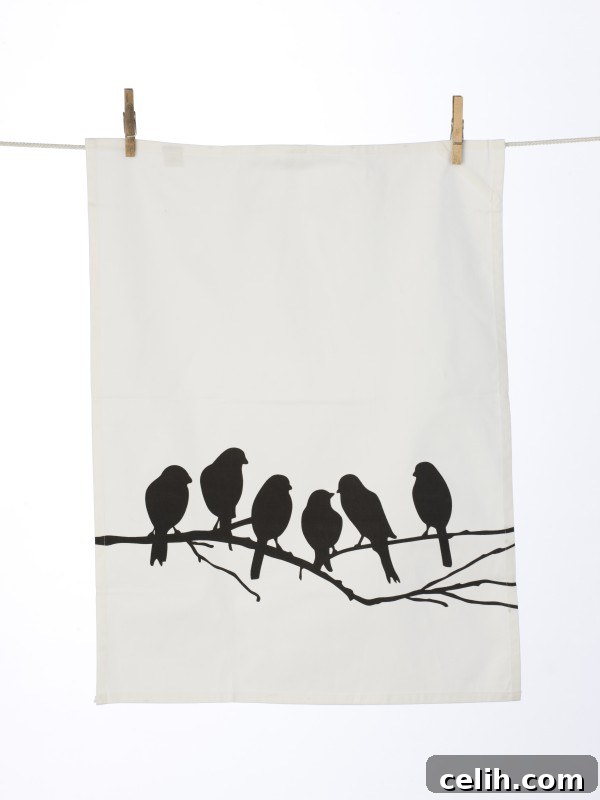 Classic black and white tea towel with six love birds perched on a branch